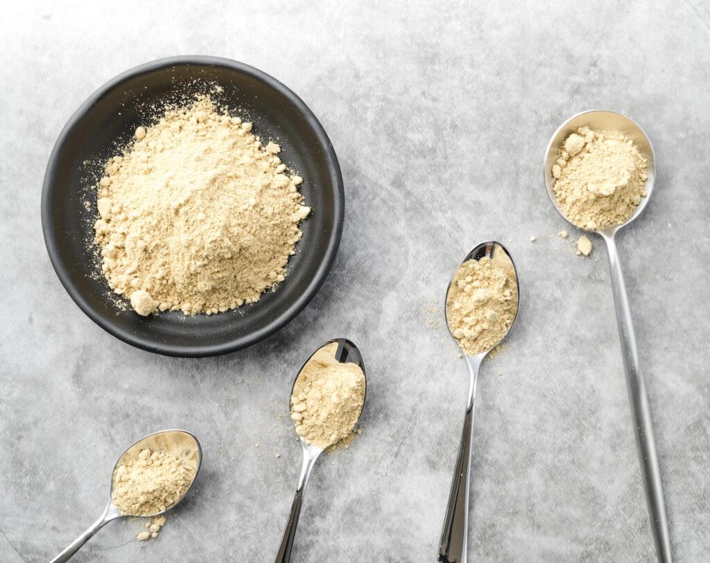 Vegan protein powder laid out on a table for presentation